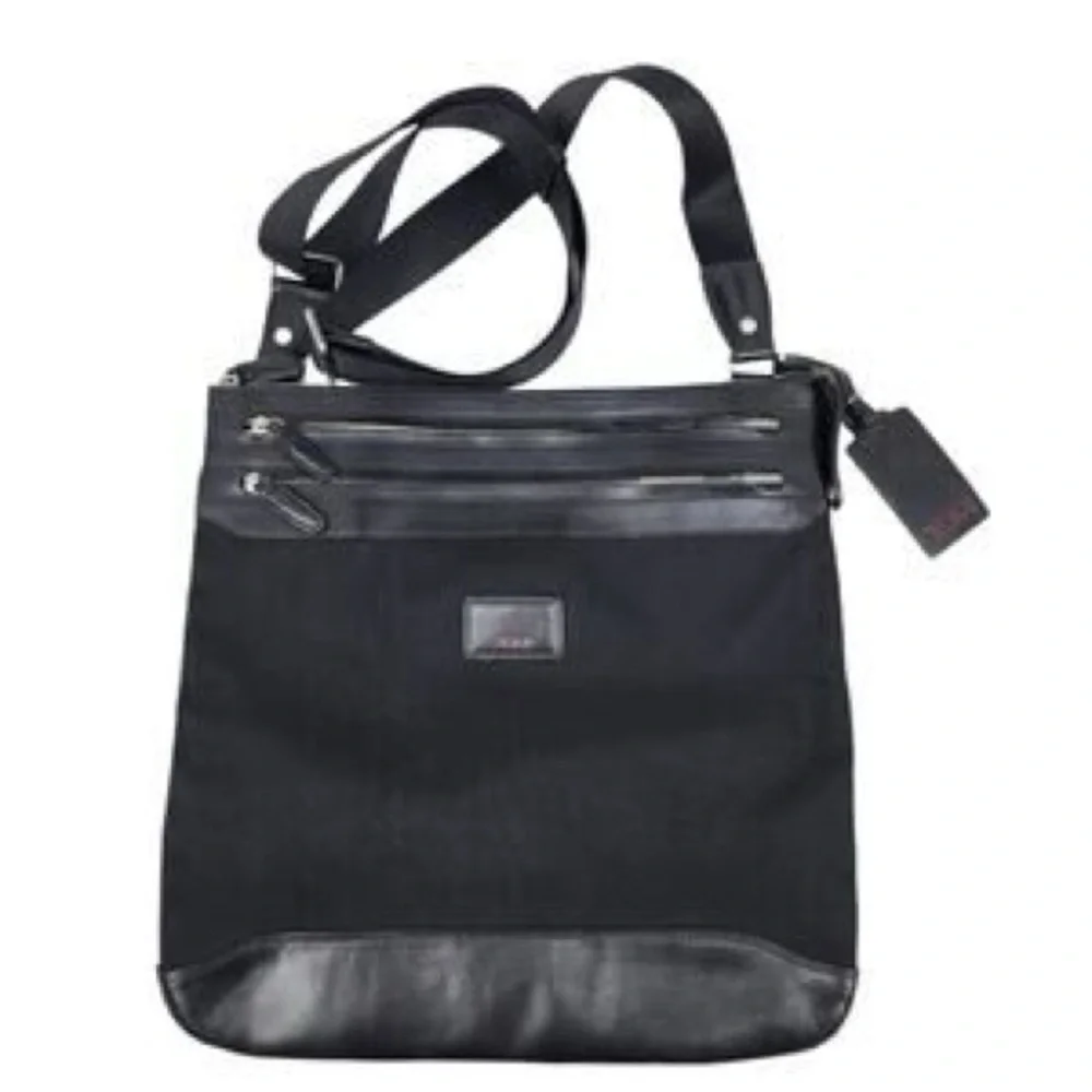 Tumi Black Messenger Bag with Silver Accents. Excellent condition
